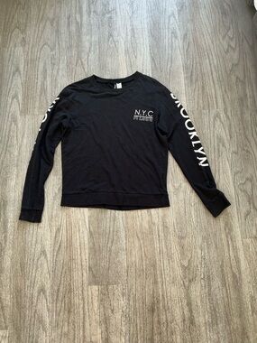 Divided Black Long Sleeve N.Y.C. Graphic Sweatshirt with BROOKLYN Sleeve Print